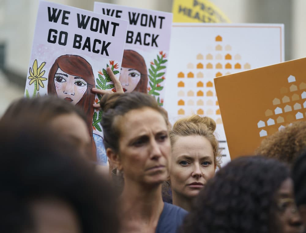 Protesters with Women's March and others hold up signs that read &quot;We Won't Go Back&quot; as they gather in front of the Supreme Court on Capitol Hill in Washington, Monday, Sept. 24, 2018. (Carolyn Kaster/AP)