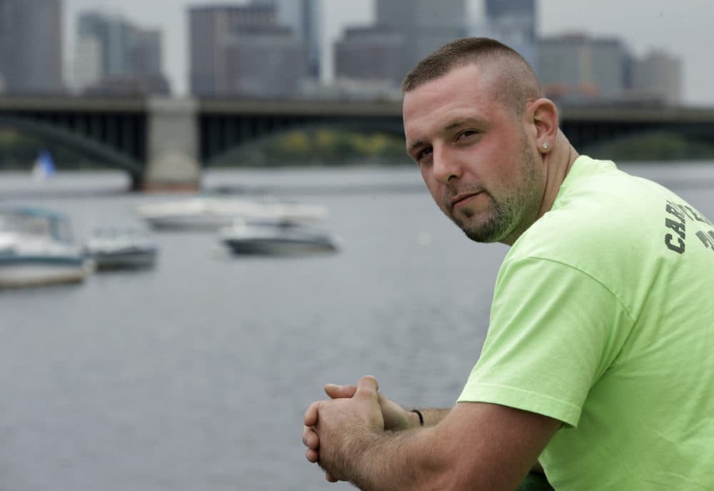 In this Monday, Oct. 1, 2018 photo Michael Robinson, of North Reading, Mass., in recovery from heroin addiction, stands for a photo near the Charles River, in Cambridge. Robinson recently became a union carpenter and has been working on building projects across the Boston area since. (Steven Senne/AP)