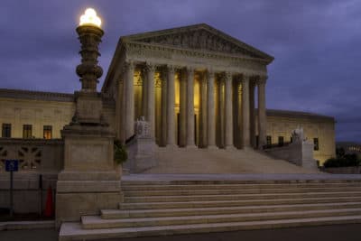 The U.S. Supreme Court building stands quietly before dawn in Washington, Friday, Oct. 5, 2018. (J. David Ake/AP)