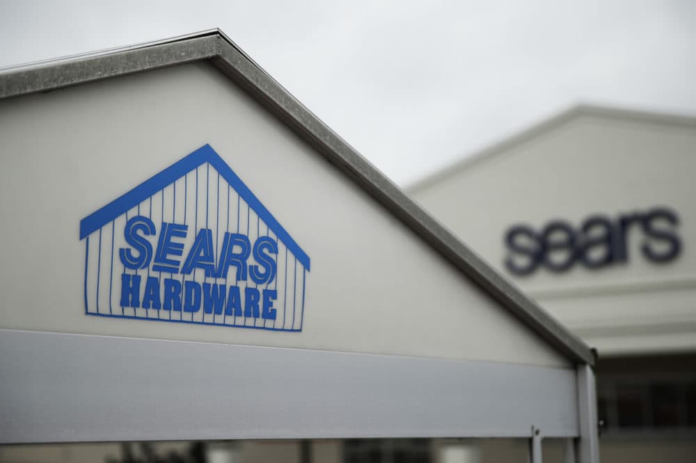 Signs for a Sears department store is displayed in Norristown, Pa., Monday, Oct. 15, 2018. Sears filed for Chapter 11 bankruptcy protection Monday, buckling under its massive debt load and staggering losses. (AP Photo/Matt Rourke)