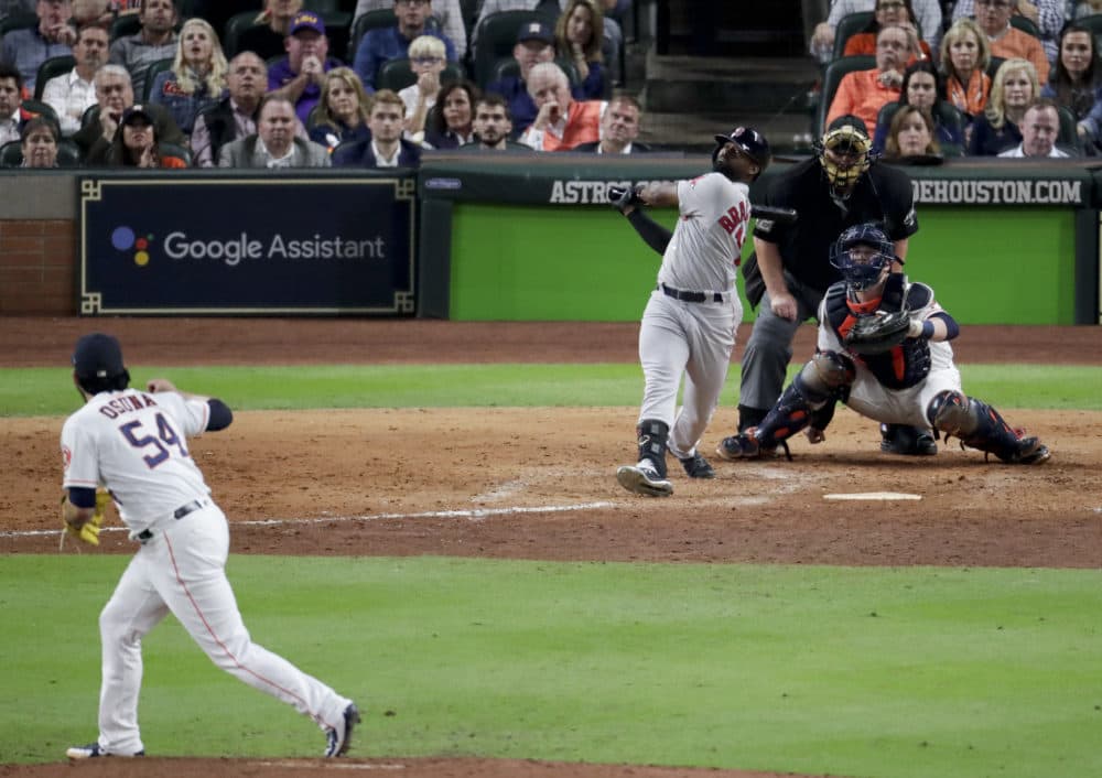 Boston Red Sox's Jackie Bradley Jr. watches his grand slam off Houston Astros relief pitcher Roberto Osuna during the eighth inning in Game 3 on Tuesday. (Lynne Sladky/AP)