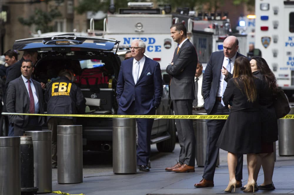 NYPD Deputy Commissioner of Intelligence &amp; Counterterrorism John Miller, center, arrives outside Time Warner Center on Wednesday, Oct. 24, 2018, in New York. Law enforcement officials say a suspicious package that prompted an evacuation of CNN's offices is believed to contain a pipe bomb. (AP Photo/Kevin Hagen)