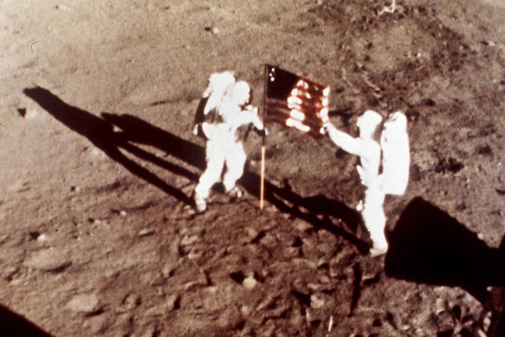 Apollo 11 astronauts Neil Armstrong and Edwin E. &quot;Buzz&quot; Aldrin, the first men to land on the moon, plant the U.S. flag on the lunar surface, July 20, 1969. (NASA via AP)