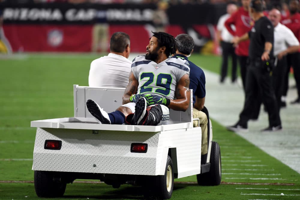 Earl Thomas is expected to miss several months with a fractured tibia. (Norm Hall/Getty Images)
