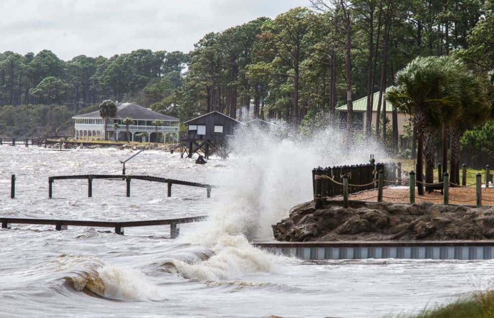 Waves crashed against a home seawall as the surge started pushing the tide higher as Hurricane Michael approached on October 9, 2018 in Eastpoint, Florida. (Mark Wallheiser/Getty Images)