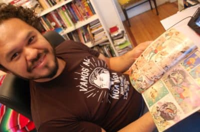 Raul Gonzalez shows off his work on the SpongeBob comic book (Dana Forsythe for WBUR)