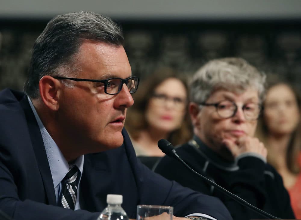 Steve Penny, former president of USA Gymnastics, pleads the Fifth, while seated next to Lou Anna Simon,(R), former president of Michigan State University, during a Senate Commerce, Science and Transportation Committee hearing, on June 5, 2018 in Washington, DC. Penny was arrested this week and charged with evidence tampering. Mark Wilson/Getty Images)