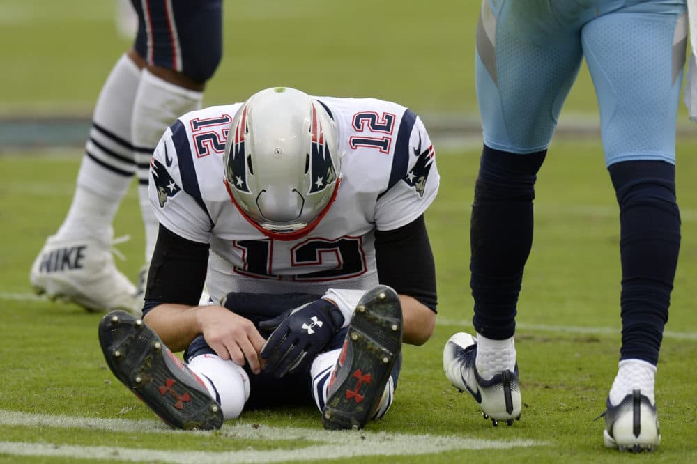 New England Patriots quarterback Tom Brady (12) sits on the turf after being sacked by the Tennessee Titans in the second half of an NFL football game Sunday, Nov. 11, 2018, in Nashville, Tenn. (Mark Zaleski/AP)