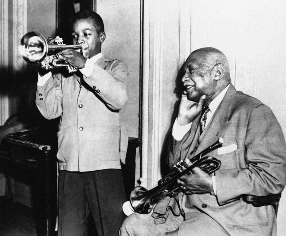 W.C. Handy (right) nods approval and chuckles as an eighth-grade pupil, Donell Callaway, 13, wails blues on his trumpet in New York City in 1954. (AP Photo)
