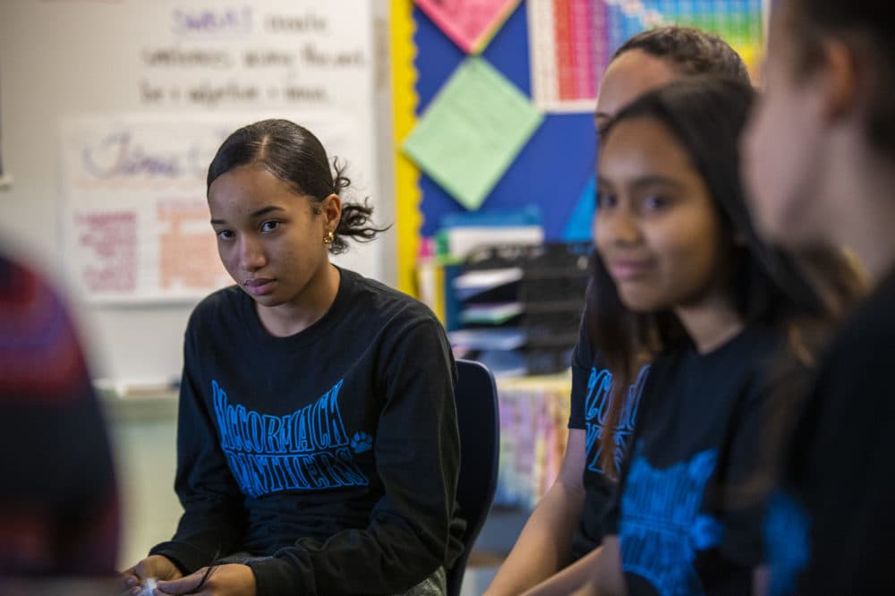 Eighth grader Bianka Bautista and other students discuss the planned closure of the McCormack Middle School during a circle in one of their classrooms.  (Jesse Costa/WBUR)