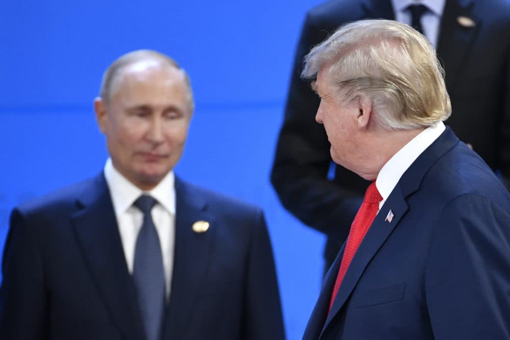 President Trump looks at Russia's President Vladimir Putin as they take their places for a photo during the G-20 summit in Buenos Aires, on Nov. 30, 2018. (Alexander Nemenov/AFP/Getty Images)