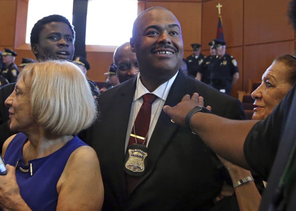William Gross is surrounded by well-wishers after he was sworn in as Boston's first black police commissioner during ceremonies, Monday, Aug. 6, 2018, in Boston. (Elise Amendola/AP)