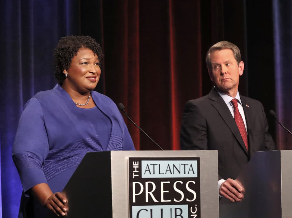 Democratic candidate for Georgia Governor Stacey Abrams, left, speaks as her Republican opponent Sec. State Brian Kemp looks on during a debate Tuesday, Oct. 23, 2018, in Atlanta. (John Bazemore/AP)