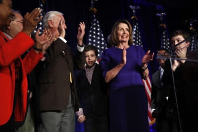 House Democratic Leader Nancy Pelosi of Calif., right, claps between her two grandsons on stage with House Democrats after speaking about Democratic wins in the House of Representatives to a crowd of Democratic supporters during an election night returns event at the Hyatt Regency Hotel, on Tuesday, Nov. 6, 2018, in Washington. (Jacquelyn Martin/AP)