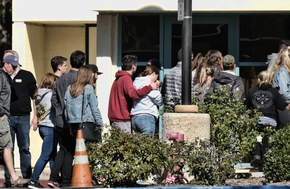 People are led into the Thousand Oaks Teen Center where families have gathered after a deadly shooting at a bar on Thursday, Nov. 8, 2018, in Thousand Oaks, Calif. Multiple people were shot and killed late Wednesday by a gunman who opened fire at the Borderline Bar &amp; Grill, which was holding a weekly country music dance night for college students. (Richard Vogel/AP)