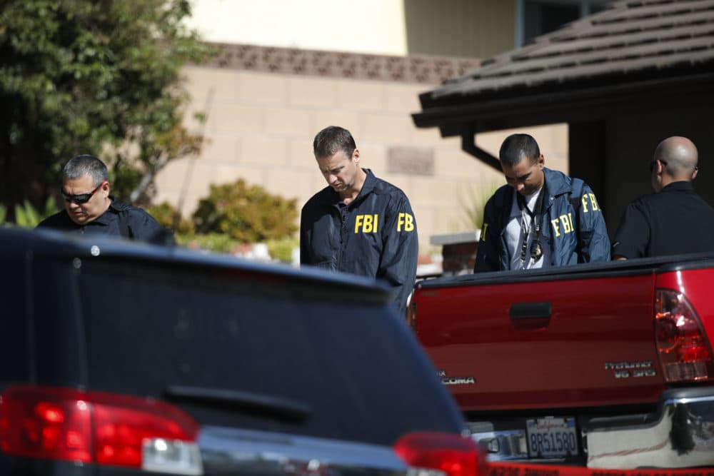 FBI agents leave the house of shooting suspect David Ian Long after conducting a search in Newbury Park, Calif., on Thursday, Nov. 8, 2018. Authorities said the former Marine opened fire at a country music bar in Southern California on Wednesday evening. (Jae C. Hong/AP)