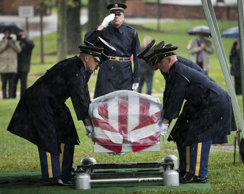 Members of the Army's 3rd US Infantry Regiment (The Old Guard) lower the coffin containing the remains of WWII Army Pfc. Cecil E. Harris, during burial services at Arlington National Cemetery in Arlington, Va., Wednesday, Oct. 22, 2014. According to the Defense Department, Harris, of Tennessee, was assigned to Army's 179th Infantry Regiment, 45th Infantry Division, when his rifle platoon came under heavy fire from German troops on Jan. 2, 1945 in Dambach, France. (AP Photo/Pablo Martinez Monsivais)