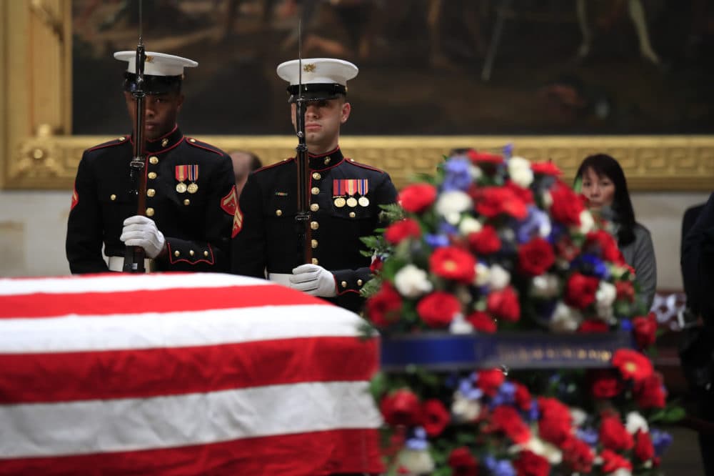 U.S. Marine Corps honor guard execute a rifle salute during the changing of the guard at the Capitol Rotunda where former President George H.W. Bush lies in state Wednesday. (Manuel Balce Ceneta/AP)
