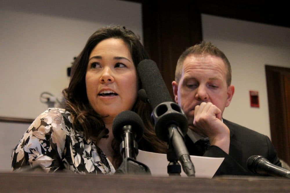 Michelle Harvey tearfully recounted her toddler's fight with cancer, which came at the same time her husband Brian, right, was locked out of his job at National Grid. (Sam Doran/State House News Service.)