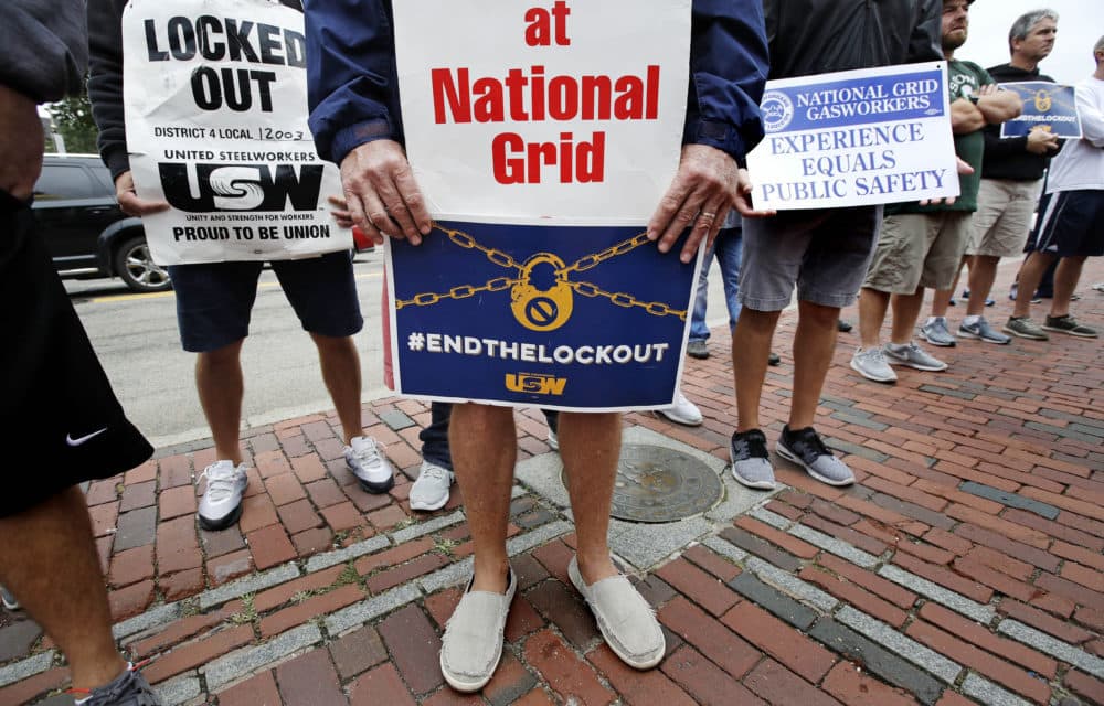 Gas workers picket on the steps of the Statehouse in Boston, Wednesday, Sept. 19, 2018. The union representing natural gas workers for National Grid says the company has locked out more than 1,000 employees in dozens of Massachusetts communities since June. (Charles Krupa/AP)