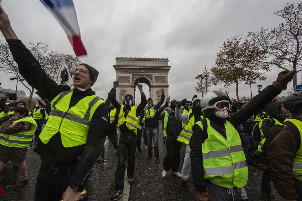 Protesters yell during a &quot;yellow vest&quot; demonstration near the Arc de Triomphe on Dec. 1, 2018 in Paris. (Veronique de Viguerie/Getty Images)
