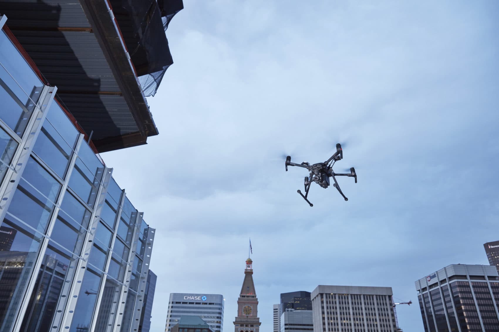 This February 2017 photo provided by DJI Technology Inc. shows a test of a type of drone in downtown Denver, that the New York Police Department can use to reduce risk to officers and bystanders during a response to dangerous situations. The department said Tuesday, Dec. 4, 2018, that potential uses for its 14 drones include search and rescue, hard-to-reach crime scenes, hostage situations and hazardous material incidents. (DJI Technology Inc. via AP)