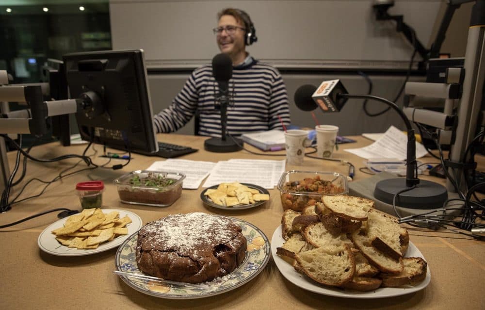 Chef (maybe) Jamie Bologna, in the Radio Boston studio with his cake. (Robin Lubbock/WBUR)