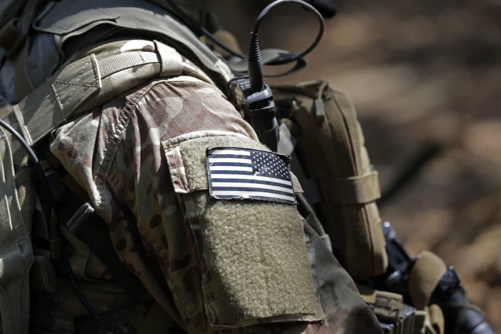 In this photo taken Friday, April 21, 2017 a United States flag patch adorns the uniform of a paratrooper with the 82nd Airborne Division's 3rd Brigade Combat Team during a training exercise at Fort Bragg, N.C. (Gerry Broome/AP)