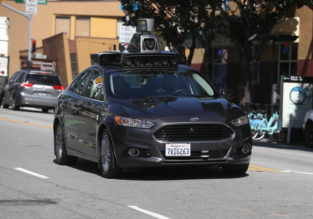 An Uber self-driving car drives down 5th Street in San Francisco. (Justin Sullivan/Getty Images)