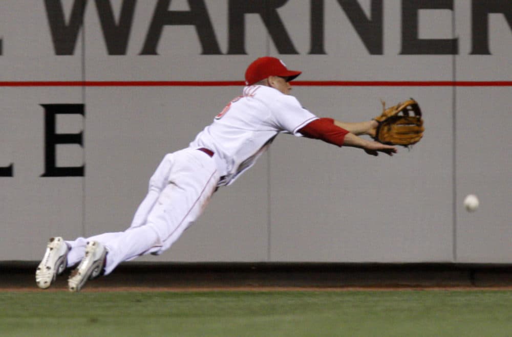 Cincinnati Reds outfielder Ryan Freel dives for a fly ball in a game against the Cleveland Indians on May 16, 2008, in Cincinnati. (David Kohl/AP)