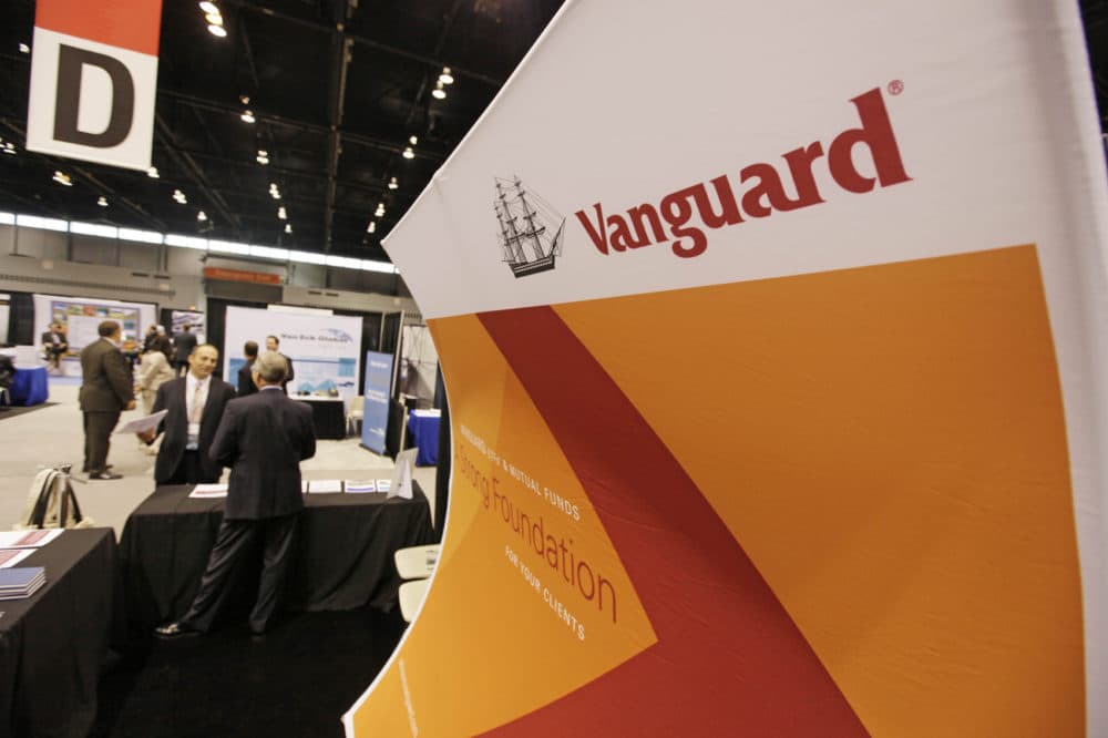An attendee of the 2010 Morningstar Investment Conference speaks with Dave Varrelman, right, a sales associate with Vanguard at the McCormick Center, Thursday, June 24, 2010, in Chicago. (AP Photo/M. Spencer Green)