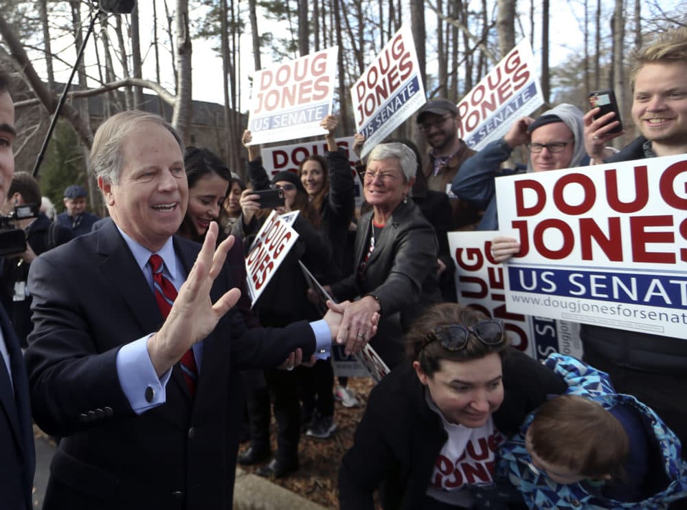 Democratic candidate Doug Jones greets supporters after casting his ballot Tuesday, Dec. 12, 2017, in Mountain Brook , Ala. (John Bazemore/AP)