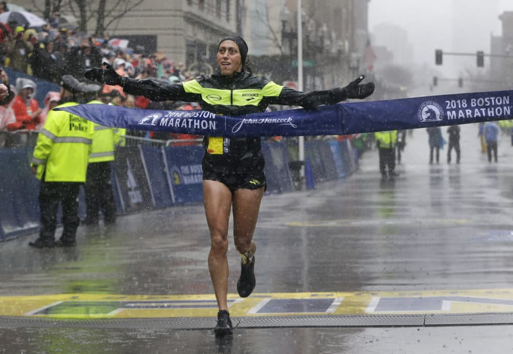 Desiree Linden crosses the finish line to win the women's division of the 122nd Boston Marathon on April 16, 2018. Linden is the first American woman to win the race since 1985. (Elise Amendola/AP)