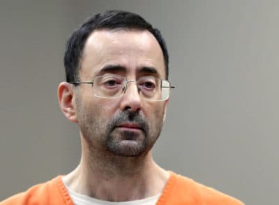In this Nov. 22, 2017, file photo, Larry Nassar, a sports doctor accused of molesting girls while working for USA Gymnastics and Michigan State University appears in court in Lansing, Mich., where he pleaded guilty to multiple charges of sexual assault. (Paul Sancya/AP)
