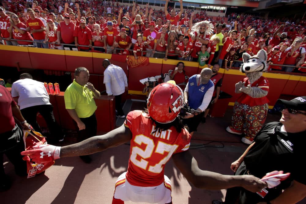 Kansas City Chiefs running back Kareem Hunt (27) celebrates with fans after an NFL football game against the San Francisco 49ers, Sunday, Sept. 23, 2018, in Kansas City, Mo. (Charlie Riedel/AP)