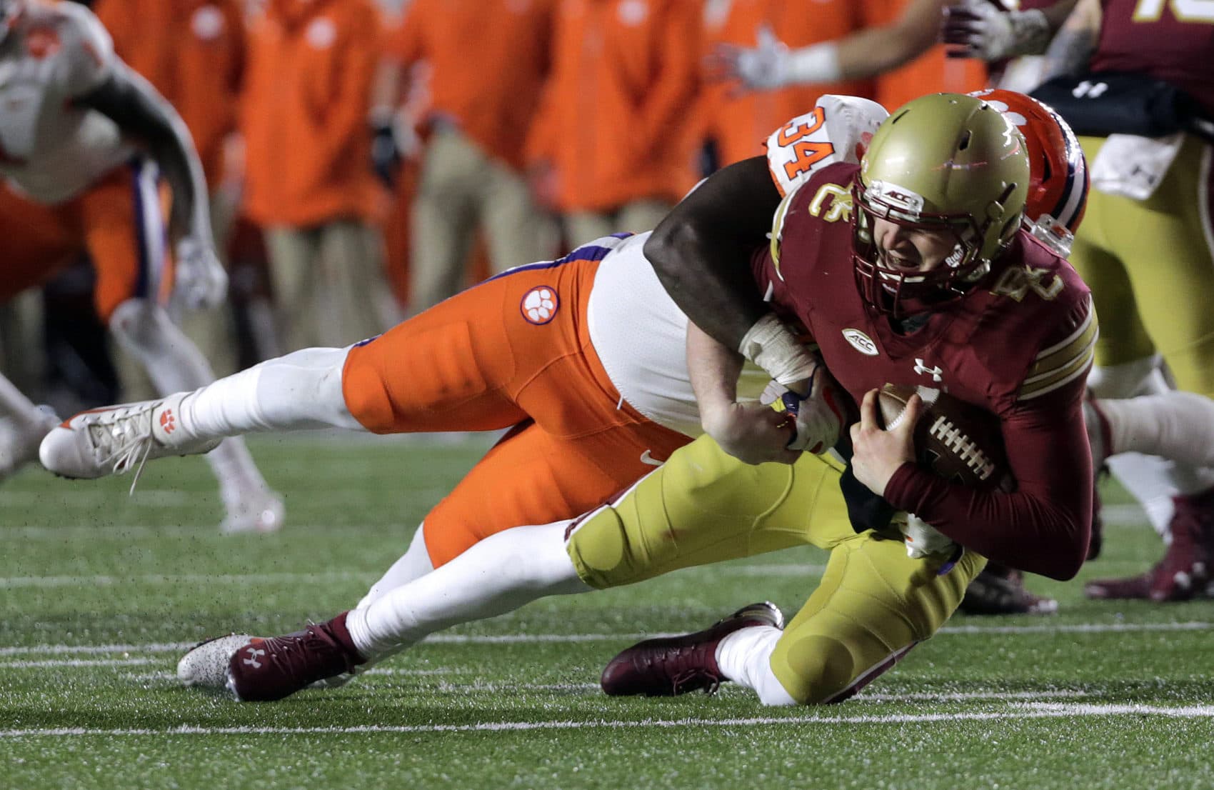 Clemson linebacker Kendall Joseph, sacked Boston College quarterback EJ Perry when the Tigers beat the Eagles in November. BC and Clemson will earn money from their bowl-game appearances. (AP Photo/Elise Amendola)