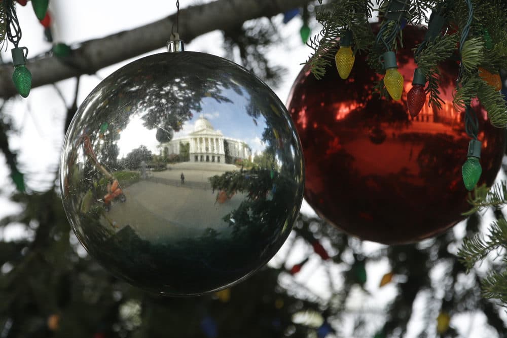 The Capitol Christmas Tree is reflected in one of the hundreds of ornaments decorating the tree Wednesday, Nov. 28, 2018, in Sacramento, Calif. (Rich Pedroncelli/AP)