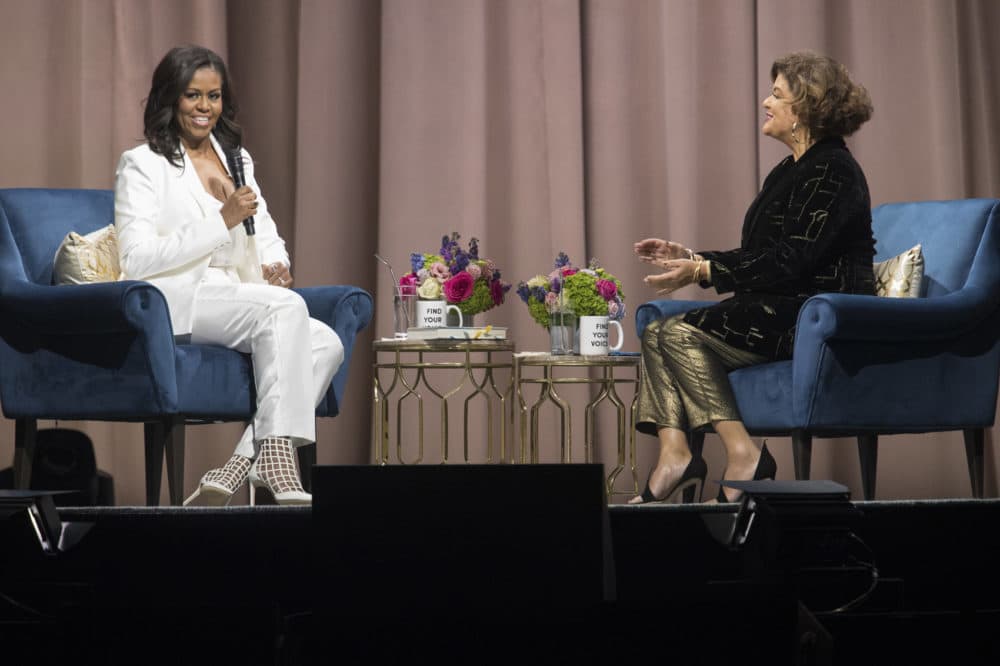 Former first lady Michelle Obama, left, is interviewed by Elizabeth Alexander during the &quot;Becoming: An Intimate Conversation with Michelle Obama&quot; at Barclays Center in Saturday, Dec. 1, 2018, in New York. (Mary Altaffer/AP)
