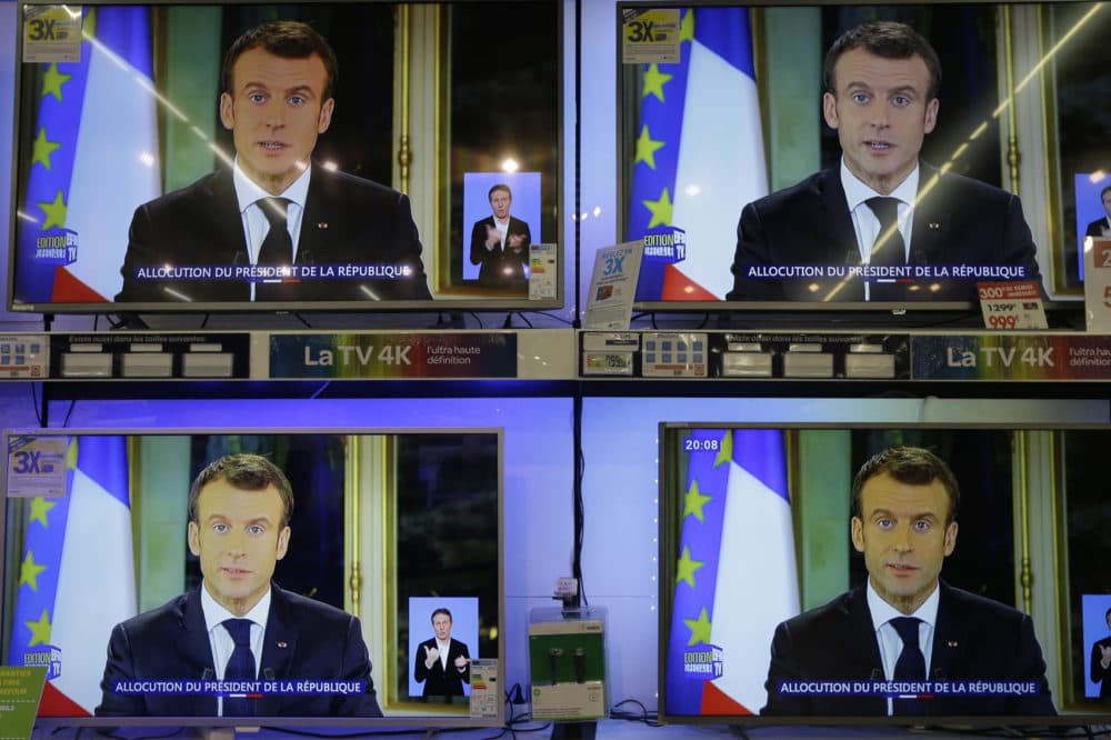 TV screens show French President Emmanuel during a televised address to the nation, at an electrical appliance store in Marseille, southern France, Monday, Dec. 10, 2018. President Emmanuel Macron has acknowledged he's partially responsible for the anger that has fueled weeks of protests in France, an unusual admission for the leader elected last year. (Claude Paris/AP)