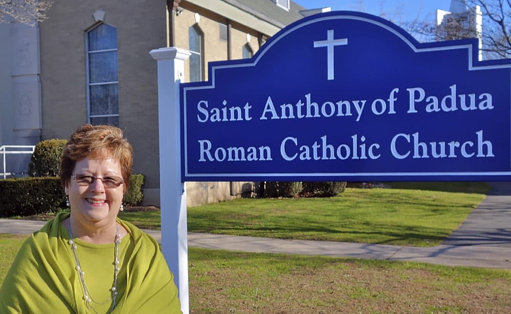 In this Dec. 7, 2018 photo provided by the Diocese of Bridgeport, Eleanor Sauers stands outside Saint Anthony of Padua Roman Catholic Church in Fairfield, Conn. Sauers, a lay woman, has been put in charge of the local parish months after the death of its priest. Her official title will be parish life coordinator and she takes the new position in January. Bishop Frank J. Caggiano has given her decision-making authority at the church, where a team of priests will say Mass and perform other ministerial duties. (Joe Pisani/Diocese of Bridgeport via AP)