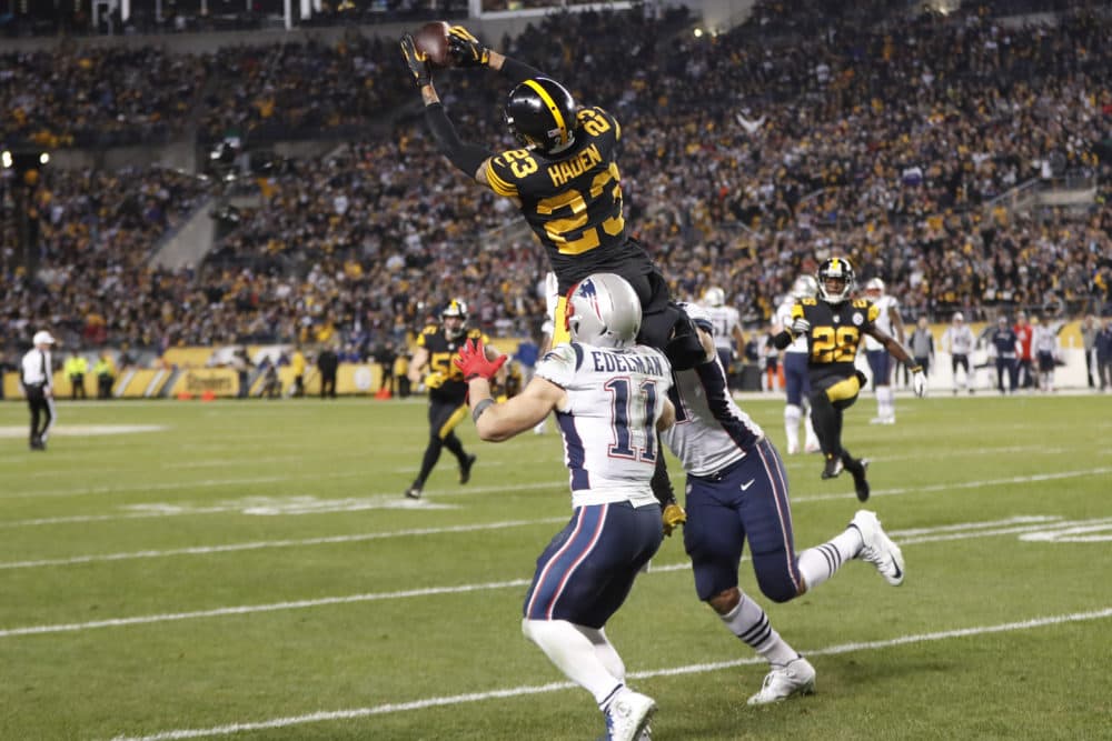 Steelers cornerback Joe Haden intercepts Tom Brady in the fourth quarter. (Keith Srakocic/AP)