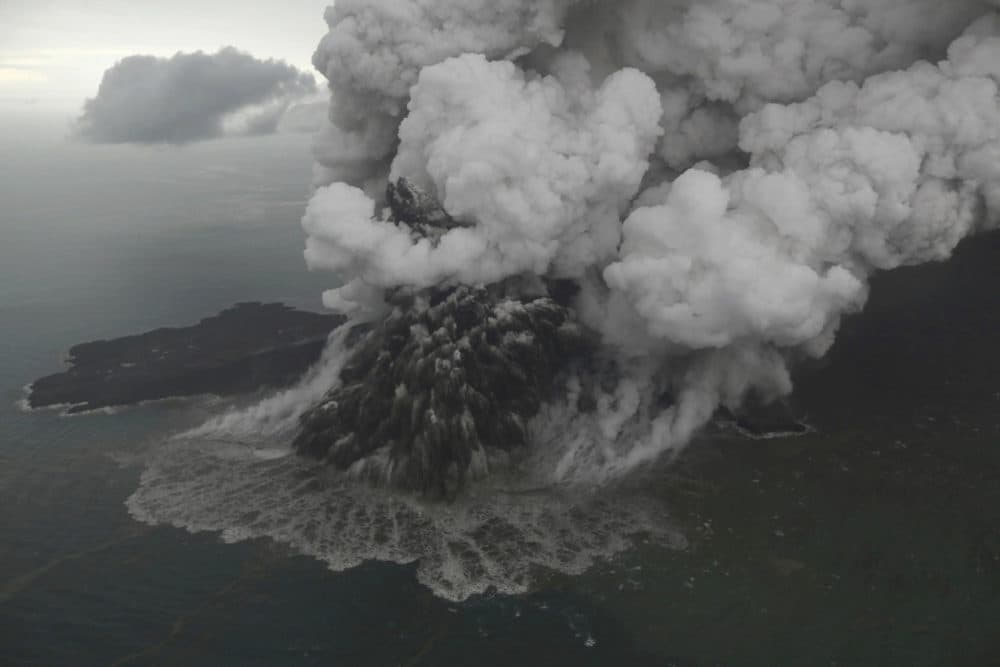 This aerial shot taken on Sunday, Dec. 23, 2018 shows Mount Anak Krakatau as it erupts on Java Strait, Indonesia. (Nurul Hidayat/Bisnis Indonesia via AP)