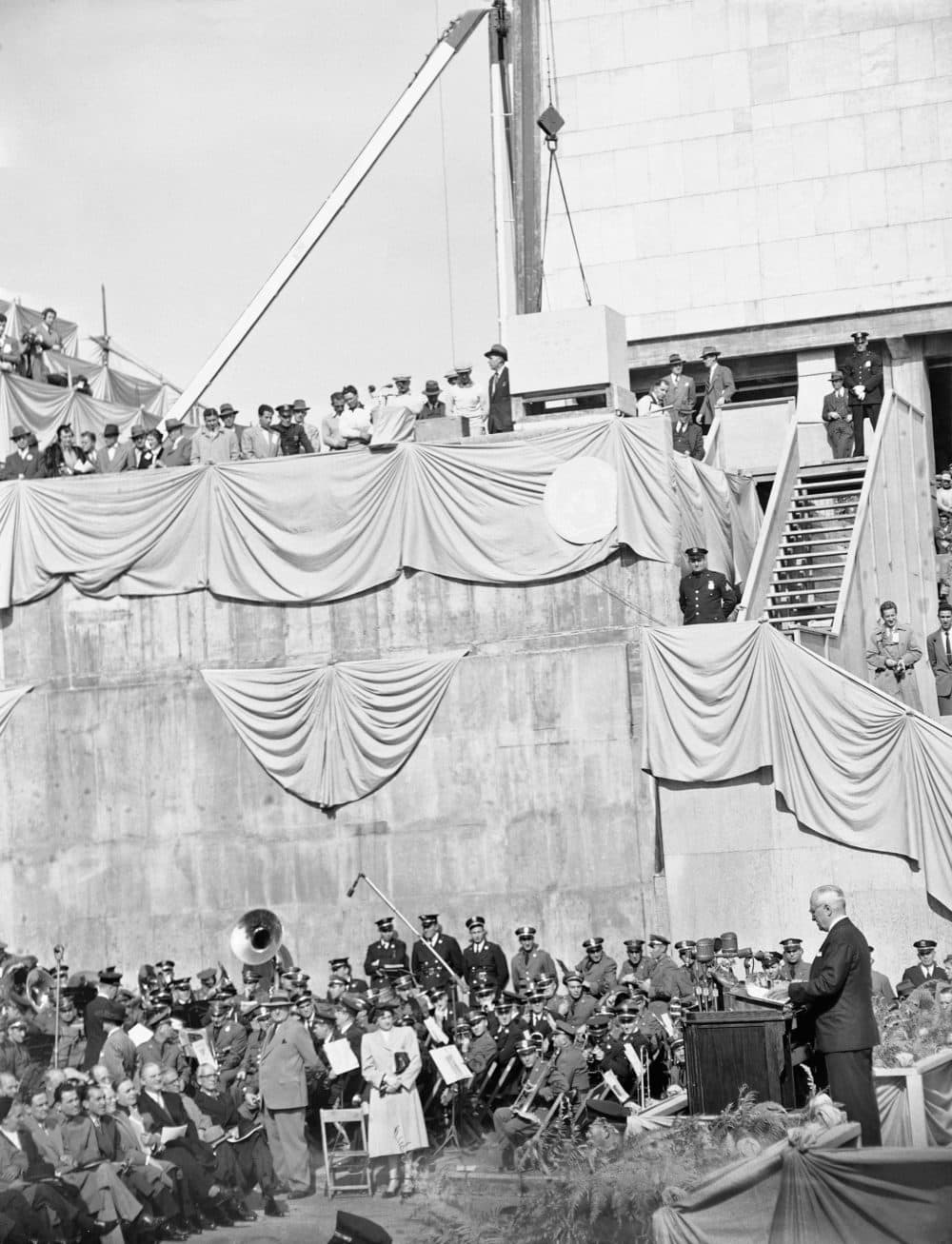 President Harry S. Truman (right), delivers a foreign policy speech at the cornerstone laying ceremony for the United Nations permanent headquarters on Oct. 24, 1949 in New York City.   High above musicians is the cornerstone which was lowered into place over a receptacle containing a copy of the U.N. charter and the U.N. declaration of human rights. (AP)