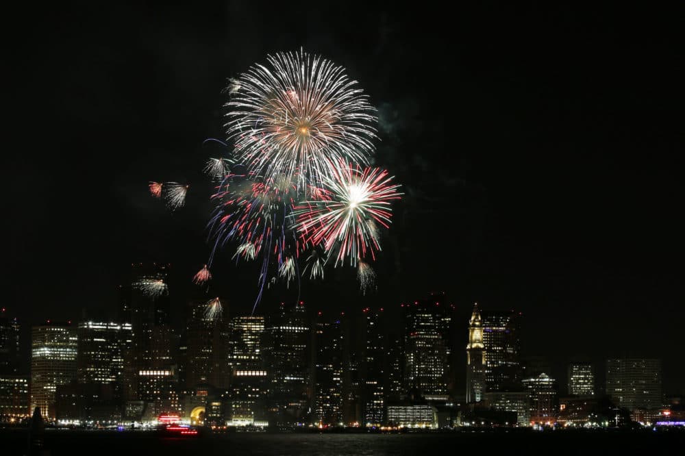 Fireworks light up the sky over Boston Harbor to celebrate First Night in Boston, Wednesday, Jan.1, 2014. (Elise Amendola/AP)