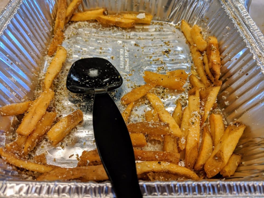 The salty remnants of a tray of fries. (Jamie Bologna/WBUR)