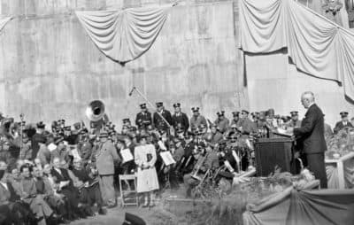 President Harry S. Truman (right) delivers a foreign policy speech at the cornerstone laying ceremony for the United Nations permanent headquarters on Oct. 24, 1949 in New York City. High above musicians is the cornerstone which was lowered into place over a receptacle containing a copy of the U.N. charter and the U.N. declaration of human rights. (AP)