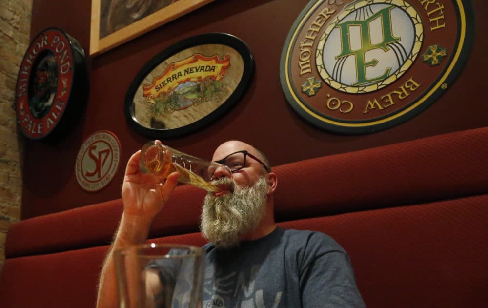 In this Dec. 20, 2018, photo, Rob Wheatley, 50, drinks a beer, at the Beer Hive Pub, in Salt Lake City. The United States' lowest DUI threshold has taken effect in Utah. Lawmakers in the state approved the 0.05 percent blood-alcohol limit in 2017, and Gov. Gary Herbert signed it into law. (Rick Bowmer/AP)