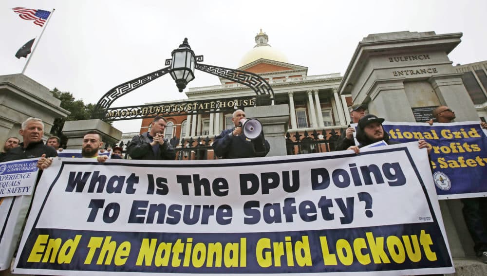 Striking gas workers picket on the steps of the State House in Boston in September 2018. (Charles Krupa/AP)