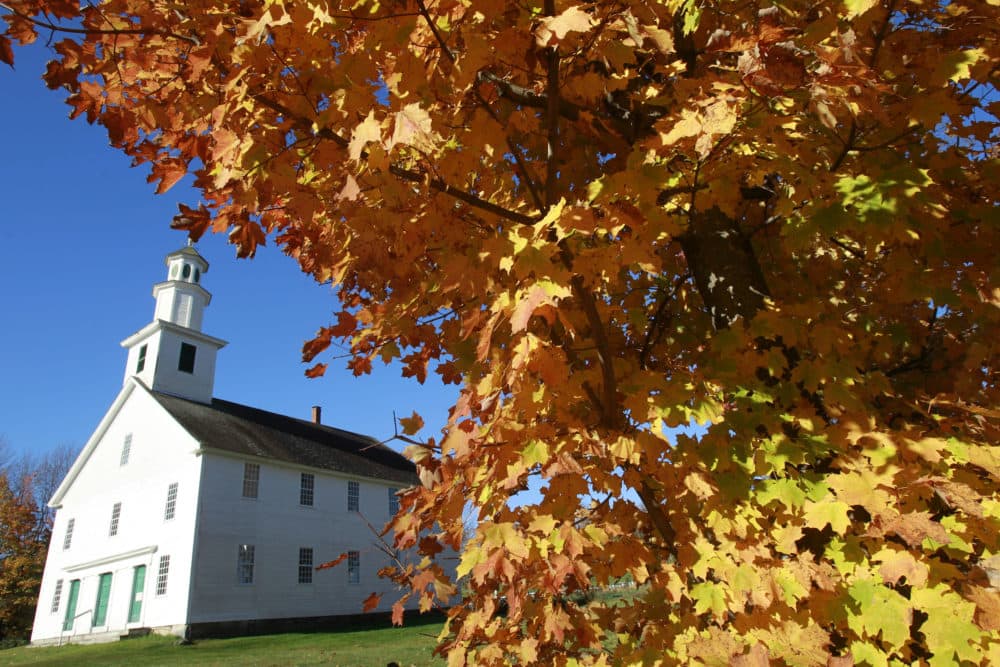 Fall leaves hang on a tree near the Old West Church on Oct. 9, 2013, in Calais, Vt. (Toby Talbot/AP)