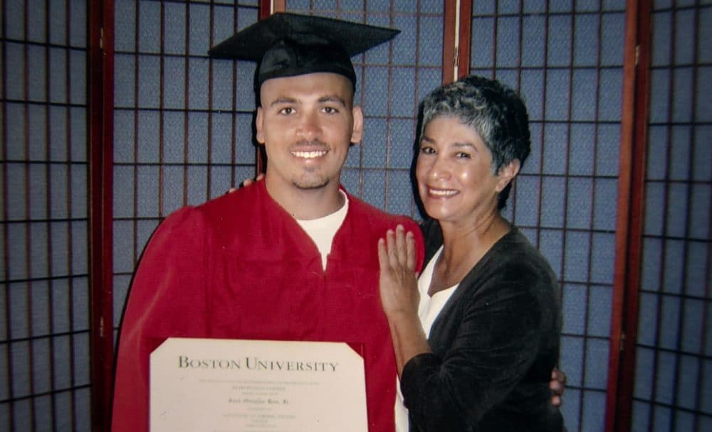 Jose Bou with his degree from Boston University, stands with Joann Mizell, who Bou says has been a mother figure in his life. (Courtesy Jose Bou)